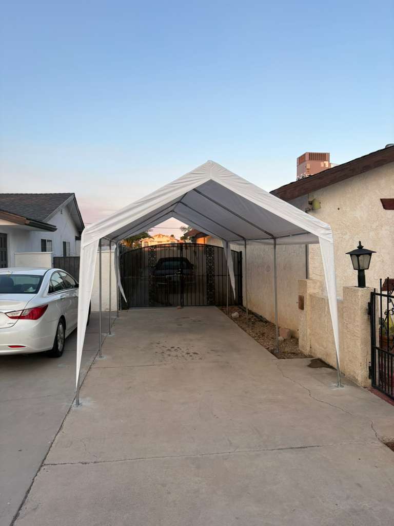 New carport shade canopy installed over a driveway