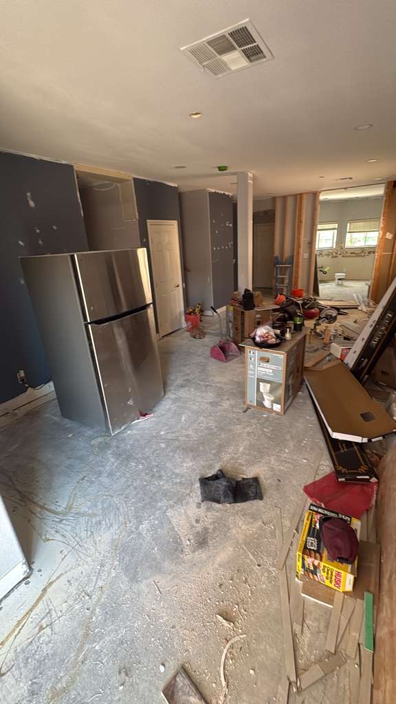 Full home remodel mid-demolition with appliances moved out