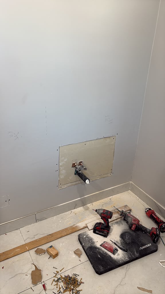 Tub valve roughed in behind a fresh access panel during a Las Vegas bathroom remodel