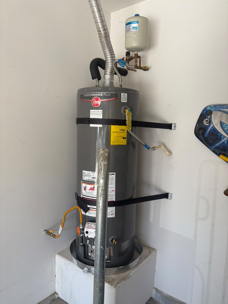 New Rheem gas water heater installed with expansion tank, seismic straps and drain pan in Las Vegas